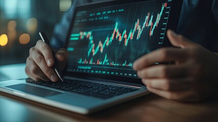 Businessman or trader is showing a growing virtual hologram stock on taplet and laptop with analysing virtual trading price graph