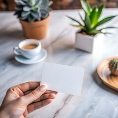 A clean and minimalist mockup of a blank business card held in hand. showcasing a perfect canvas for design inspiration.