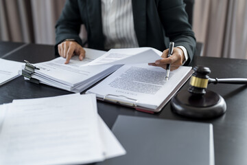 Lawyer businessman working with lawbook in office or courtroom Legal counsel with gavel and legal law. justice and lawyer concept Judge gavel hammer on Lawyer desk