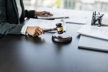 Lawyer businessman working with lawbook in office or courtroom Legal counsel with gavel and legal law. justice and lawyer concept Judge gavel hammer on Lawyer desk