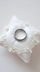 Wedding Ring on White Lace Pillow