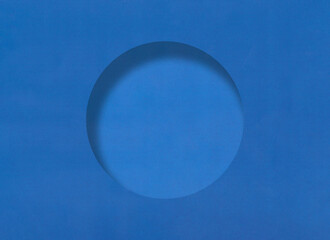 Blue paper background with minimalistic round hole and have shadow.