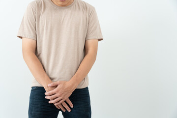 Man hold hand in front of private parts feeling discomfort from disease and inflammation. Venereal,...