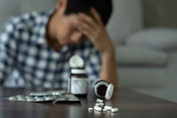 asian man use pills overdose, stressed, sad, drug abuser, drug addict, sick, unhealthy, unhappy, suicide, depressed or hopeless, Anti drug, drug addict, life and family problems, unmotivated