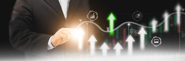 Businessman using finger touch symbol arrow up,stock graph and chart background,concept growth business and investment,Stock market and strategy for making market plan and stock market fluctuations