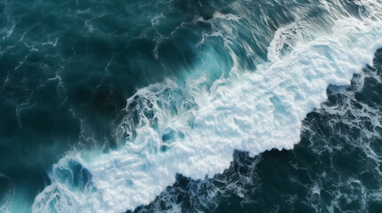 Fototapeta premium Spectacular aerial top view background photo of ocean sea water white wave splashing in the deep sea. Drone photo backdrop of sea wave in bird eye waves.