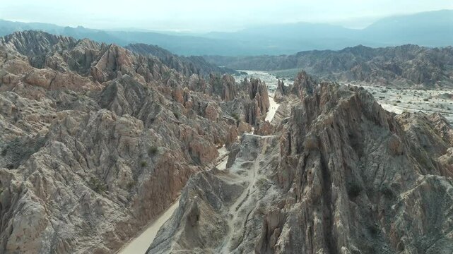 A stunning aerial drone image showcasing the dramatic landscape of Quebrada de las Flechas in Salta, Argentina. Drone 4k.