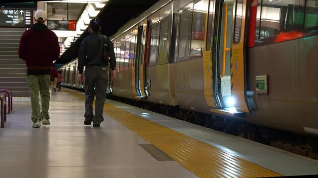 Train stops at the platform of Toowong station, Translink Queensland Rail.