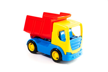 Dump truck toy isolated on white background. Construction industrial equipment for transporting materials