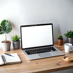 Fototapeta premium Modern workspace mockup with a laptop. notebook. and potted plants on a wooden desk.