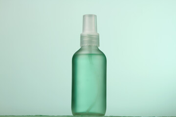 Cosmetics for face skin care. Face serum on green background