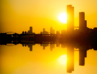 Fototapeta premium City town skyline with Reflection in Pastel Sunset colors