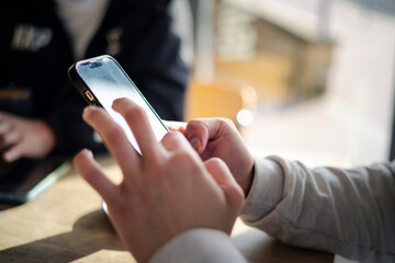 Close up man using smart phone, Social media marketing concept. hand using smartphone typing, chatting conversation in chat box icons pop up