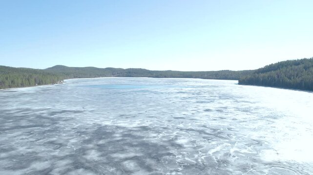Drone footage of a lake de-icing during late spring.