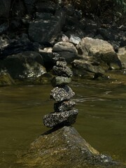 Homemade rock tower in the river