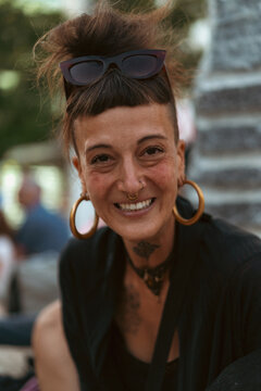 Happy woman laughing on the street, portrait, close-up.