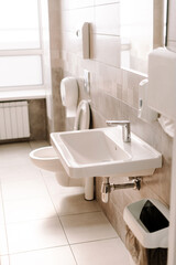 Modern public bathroom interior with nobody using it