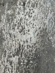 Obraz premium Weathered Concrete Texture with Natural Gray and Yellow Patina | Close-up of weathered gray concrete texture with natural patterns and a touch of yellow patina, ideal for backgrounds, design projects