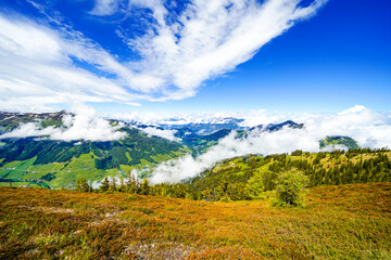 View from Schatzberg of the surrounding landscape. Idyllic nature in Wildschönau in the Kufstein district in Austria. Mountain landscape in the Kitzbühel Alps in Tyrol.
