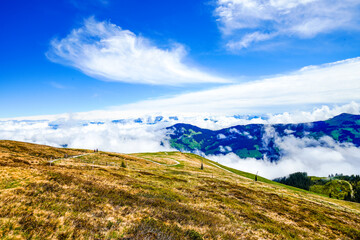 View from Schatzberg of the surrounding landscape. Idyllic nature in Wildschönau in the Kufstein district in Austria. Mountain landscape in the Kitzbühel Alps in Tyrol.
