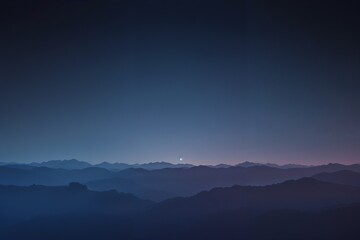 Deep blue landscape with distant mountains under a twilight sky, creating a peaceful and calming atmosphere. Perfect for nature and travel themes.