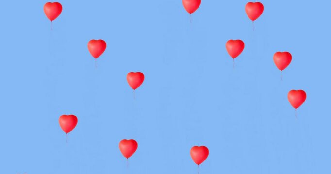Red heart-shaped balloons floating on blue background animation