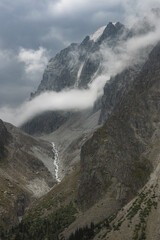 Heavy clouds and overcast weather in the scenic mountain pass of a rugged Ala-Archa national park