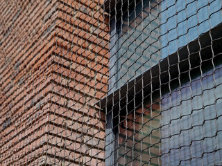 house has a protective net to prevent nesting of pigeons on the window ledges. fecal pollution is...
