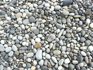 Stone pebbles as an abstract background. Texture