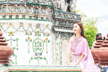 Beautiful women visiting Bangkok attractions and landmarks in Thailand  Young happy tourists exploring a south-east asian city
