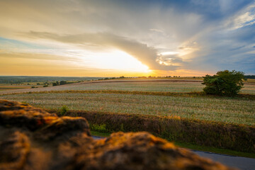 Beautiful landscape showing fields and hills at sunset. View from the stone observation tower. Roztocze, Susiec, Poland