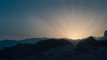 desert with rocky mountains and sky with clouds in the evening in Egypt