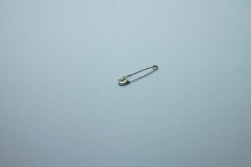 Used stainless steel covered safety pin