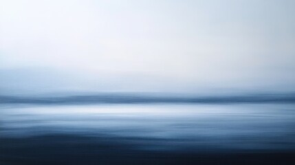 Soft abstract gradients in cool blues and grays, evoking the serene calm of a winter evening