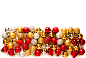 Multi-colored New Year's balls. Border, Christmas composition with balls on a white background. Top view, flat lay. Empty space for copy space