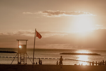 lifeguard tower at sunset