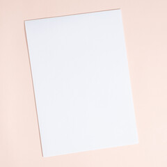 Blank Sheet of Paper on Beige Background, Top View, Space for Text