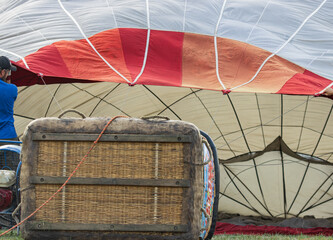 assembling a hot air balloon outdoors.