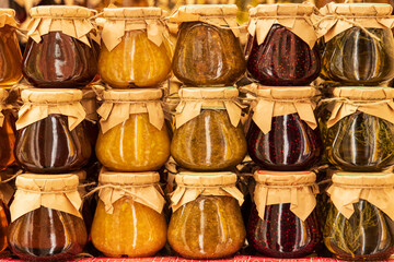 various jams in jars as a background.