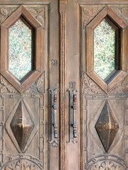 Old wooden door with metal ornaments