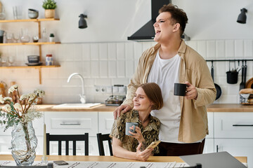 Two friends share laughter and snacks in a cozy kitchen.
