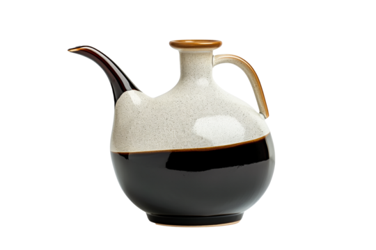 A sleek black teapot of soy sauce with a red cap isolated on a white transparent background. Condiment concept.