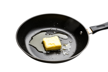 Butter cubes melt in a frying pan, ready for use in a culinary dish. isolated on white transparent background.