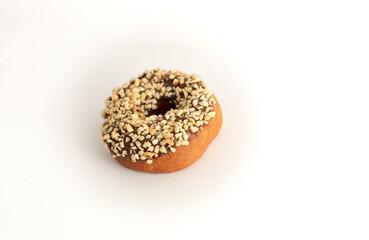 donut with sprinkles on a light background, sweet pastries, donut day, fat thursday
