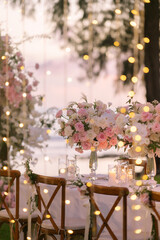 Dinner table decorated with beautiful flowers.