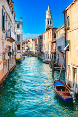 A stunning and beautiful view of a picturesque Venice canal, showcasing vibrant architecture and tranquil waters