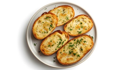 Garlic bread slices on a plate with fresh herbs