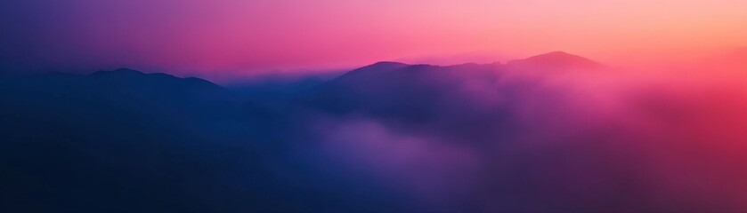 Fototapeta premium A breathtaking sunset over misty mountains, creating a serene and colorful landscape with soft hues and gentle shadows.