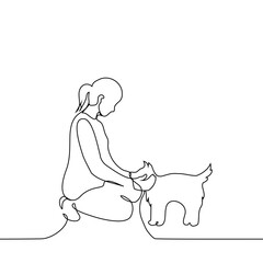 woman kneeling down and stroking a dog - one line art vector. concept female dogman, owner and pet
