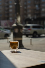 Cappuccino in a glass cup in a cafe in the center of Kyiv